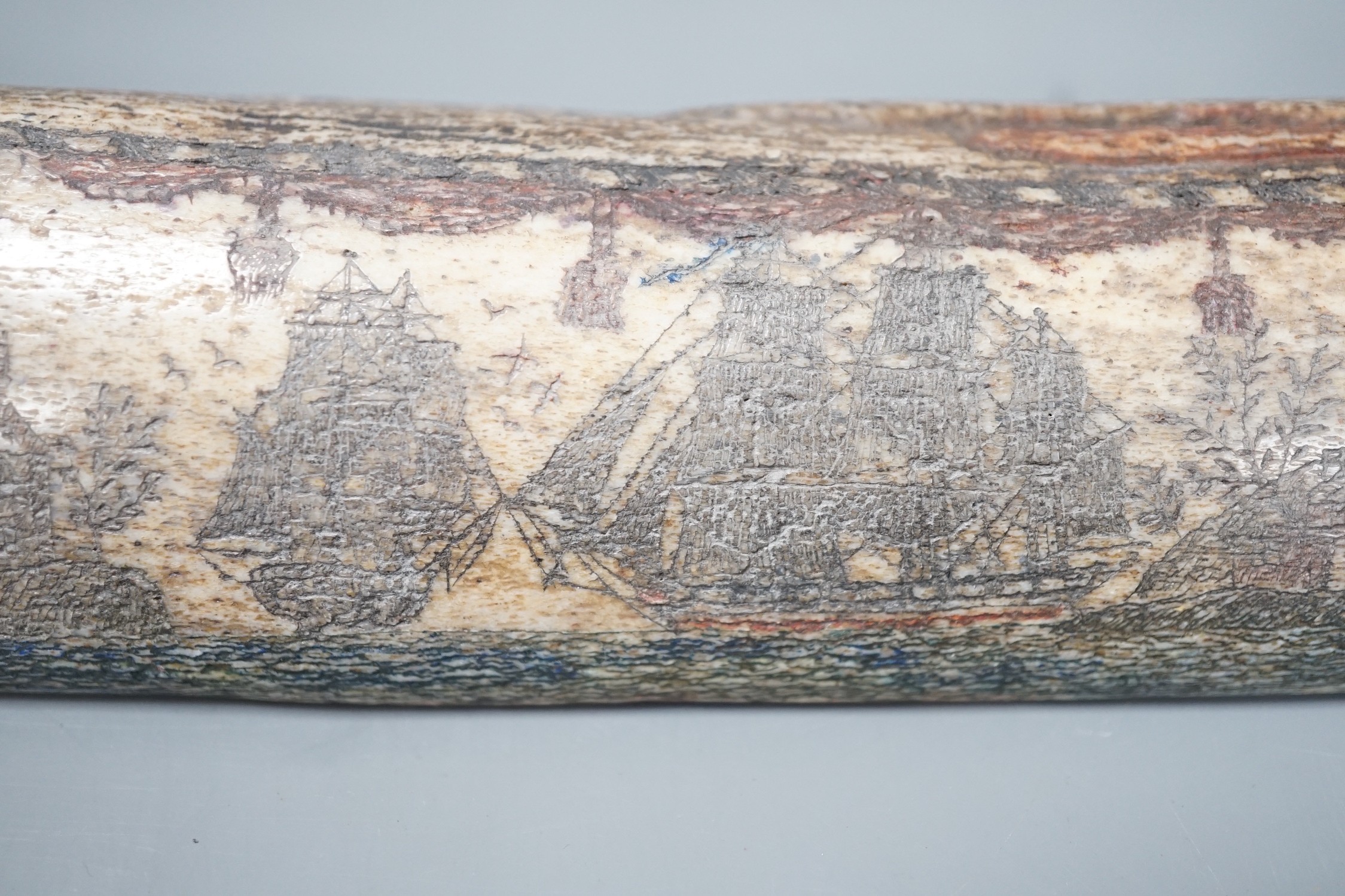 An 18th/early 19th century scrimshaw whale bone carving, 19cm